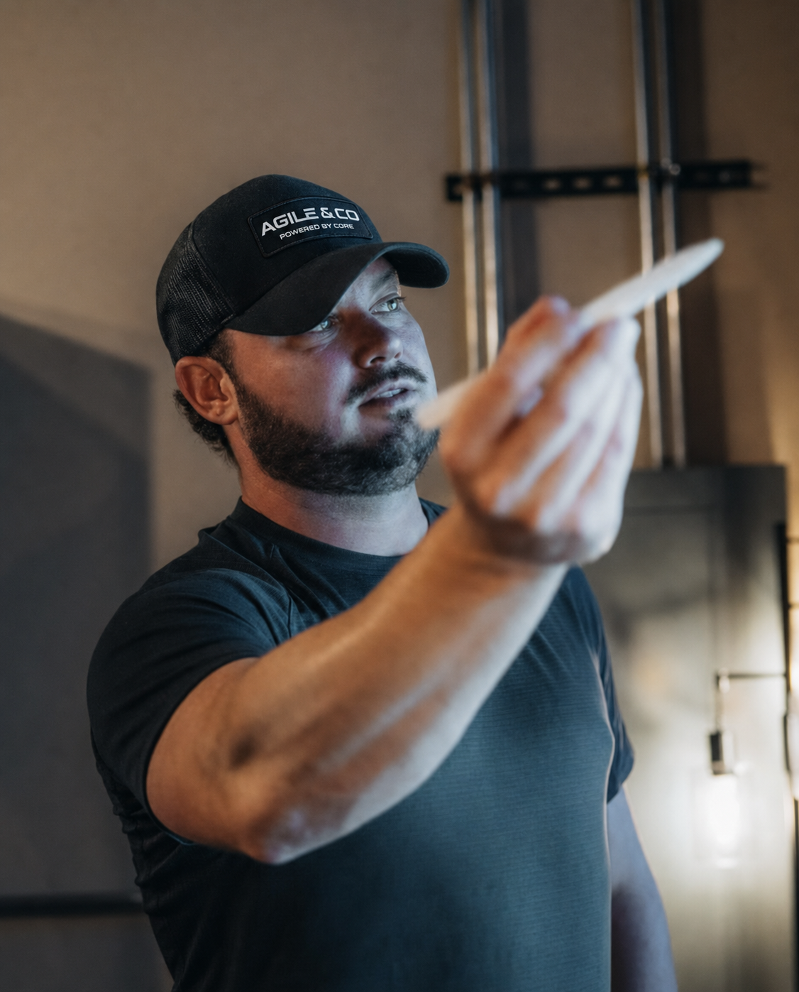 Agile & Co strategist holding a pen while working at a whiteboard