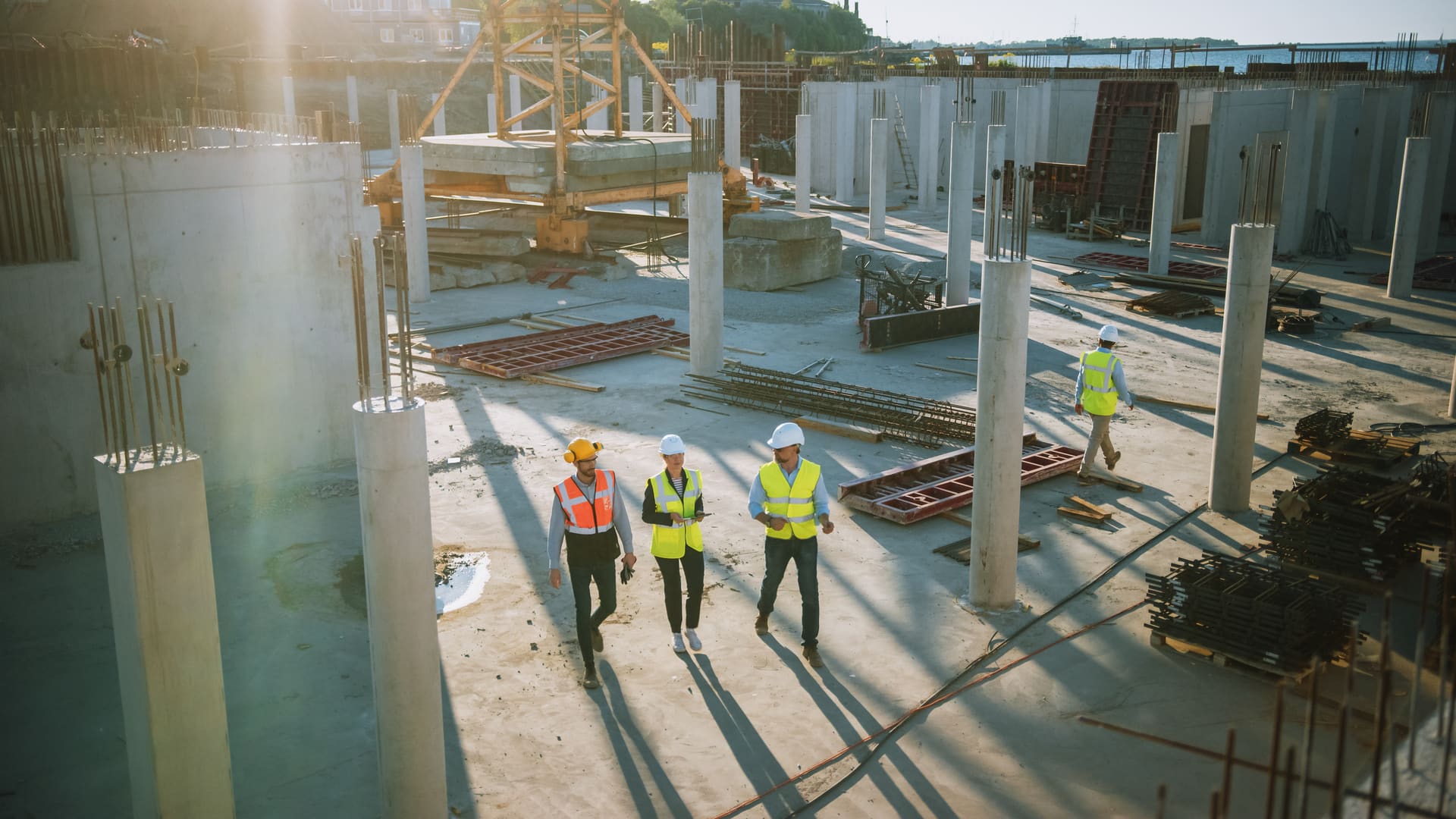 Contractors walking through an active construction site