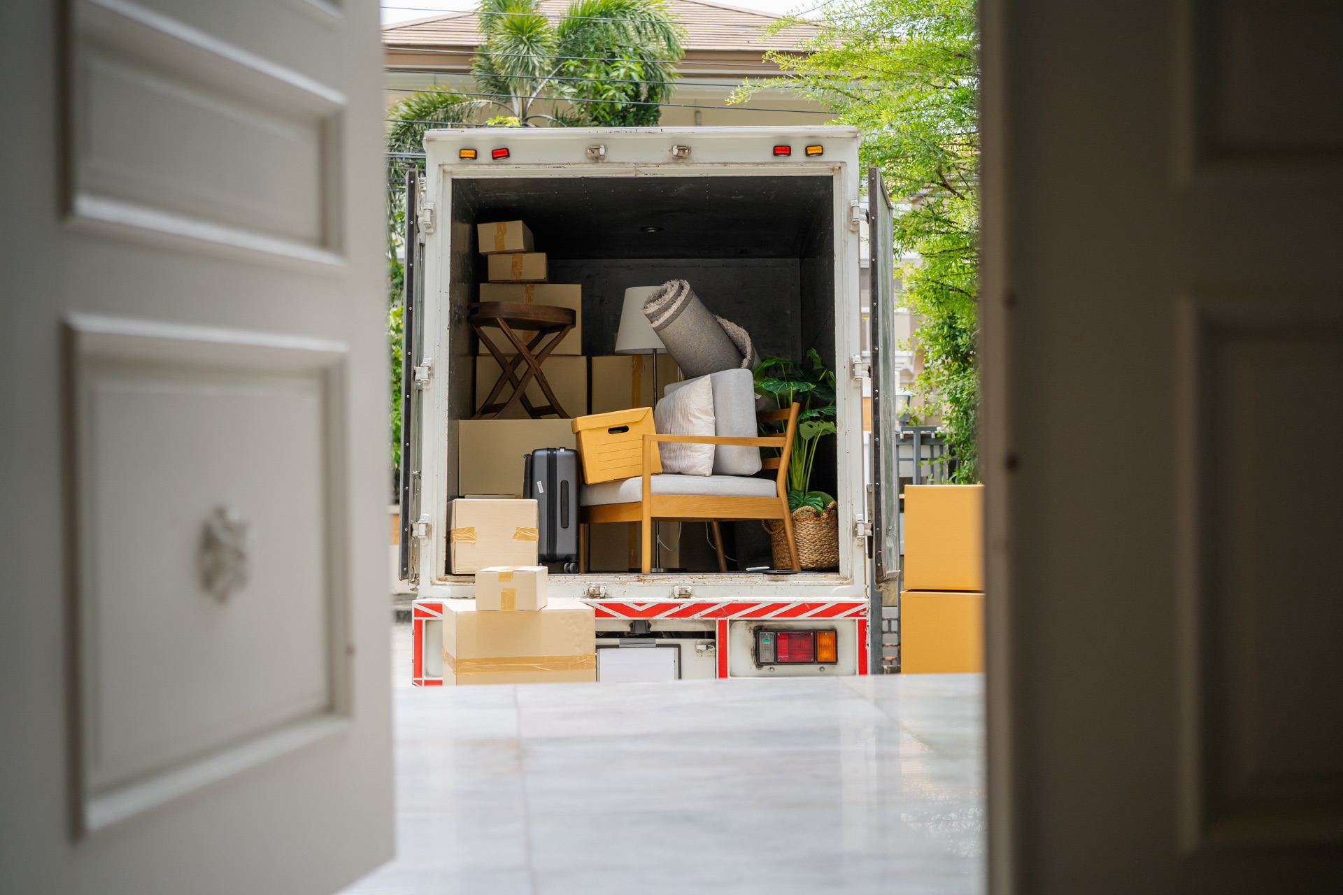 Loaded moving truck parked outside a residential home