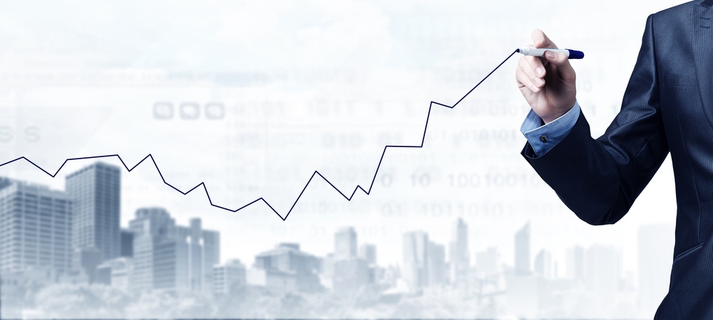 Close up of businessman drawing increasing graph with marker-1.jpeg